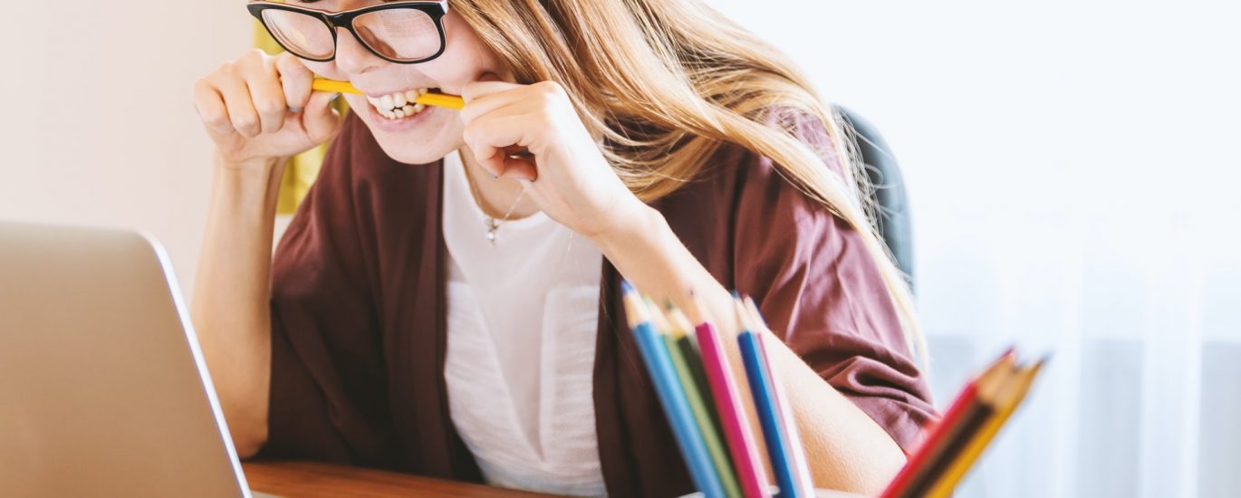 Frustrated woman looking at a computer