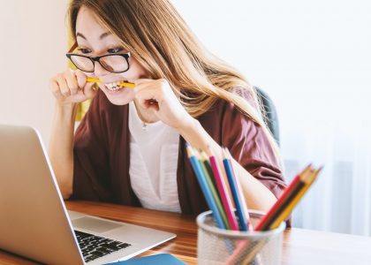 Frustrated woman looking at a computer